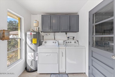 COASTAL LIVING with CHARACTER... Where MORNINGS START ON THE on Palm Harbor Golf Club in Florida - for sale on GolfHomes.com, golf home, golf lot