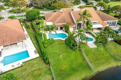 Exquisite lake and pool views offered at this 3 bedroom, 3.5 on Frenchmans Creek Country Club in Florida - for sale on GolfHomes.com, golf home, golf lot