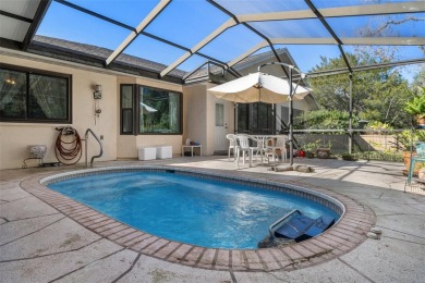 One or more photo(s) has been virtually staged. Charming Home in on Sugarmill Woods Golf and Country Club in Florida - for sale on GolfHomes.com, golf home, golf lot