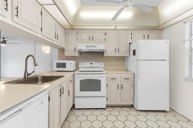 Welcome to this charming and spacious 2nd-floor condo located in on Wynmoor Golf Course in Florida - for sale on GolfHomes.com, golf home, golf lot