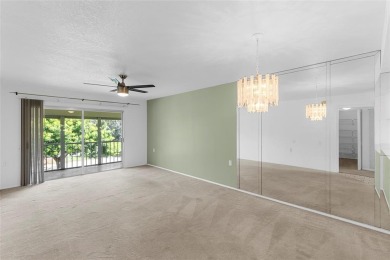 Welcome to this charming and spacious 2nd-floor condo located in on Wynmoor Golf Course in Florida - for sale on GolfHomes.com, golf home, golf lot