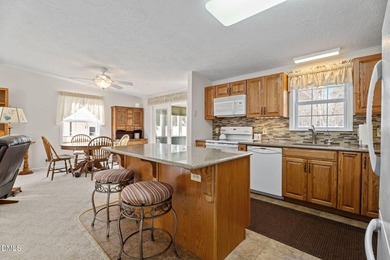 Welcome to lake living in this charming Ranch home located in a on River Golf and Country Club at Lake Royale in North Carolina - for sale on GolfHomes.com, golf home, golf lot