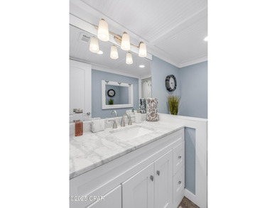 UPDATED. GOLF NEXT DOOR. MINUTES TO THE BEACH. This 2-bed on Holiday Golf Club in Florida - for sale on GolfHomes.com, golf home, golf lot