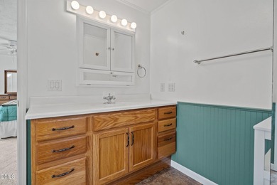 Welcome to lake living in this charming Ranch home located in a on River Golf and Country Club at Lake Royale in North Carolina - for sale on GolfHomes.com, golf home, golf lot