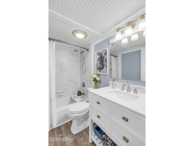 UPDATED. GOLF NEXT DOOR. MINUTES TO THE BEACH. This 2-bed on Holiday Golf Club in Florida - for sale on GolfHomes.com, golf home, golf lot