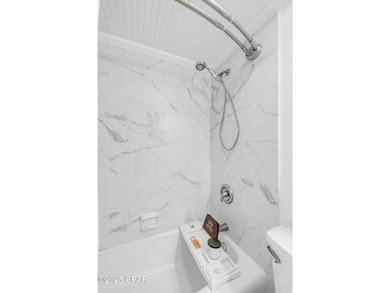 UPDATED. GOLF NEXT DOOR. MINUTES TO THE BEACH. This 2-bed on Holiday Golf Club in Florida - for sale on GolfHomes.com, golf home, golf lot