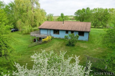 Beautiful acreage set up for horses! This lovely 3 bed, 1.5 bath on Grand Rapids Sparta Moose Golf Course in Michigan - for sale on GolfHomes.com, golf home, golf lot