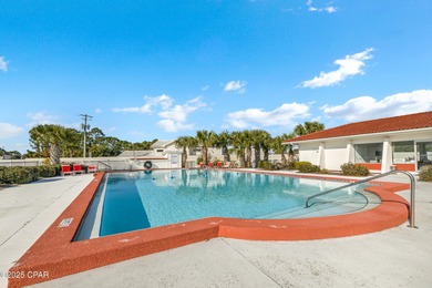 UPDATED. GOLF NEXT DOOR. MINUTES TO THE BEACH. This 2-bed on Holiday Golf Club in Florida - for sale on GolfHomes.com, golf home, golf lot