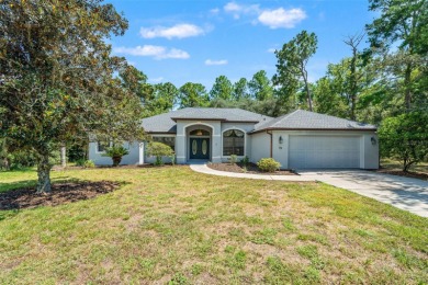 Built by Lindhorst, this warm and welcoming pool home is on Sugarmill Woods Golf and Country Club in Florida - for sale on GolfHomes.com, golf home, golf lot