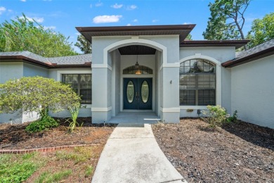 Built by Lindhorst, this warm and welcoming pool home is on Sugarmill Woods Golf and Country Club in Florida - for sale on GolfHomes.com, golf home, golf lot