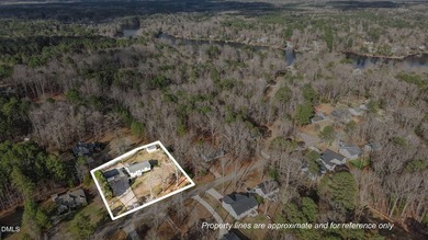 Welcome to lake living in this charming Ranch home located in a on River Golf and Country Club at Lake Royale in North Carolina - for sale on GolfHomes.com, golf home, golf lot