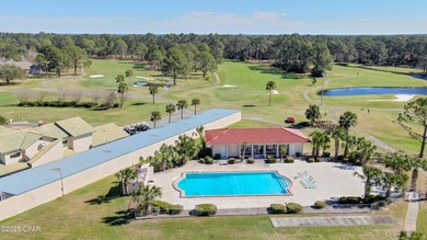 UPDATED. GOLF NEXT DOOR. MINUTES TO THE BEACH. This 2-bed on Holiday Golf Club in Florida - for sale on GolfHomes.com, golf home, golf lot