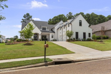 Experience resort-style living in this exceptional residence on Reunion Golf Club in Mississippi - for sale on GolfHomes.com, golf home, golf lot