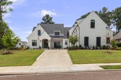 Experience resort-style living in this exceptional residence on Reunion Golf Club in Mississippi - for sale on GolfHomes.com, golf home, golf lot