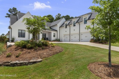 Experience resort-style living in this exceptional residence on Reunion Golf Club in Mississippi - for sale on GolfHomes.com, golf home, golf lot