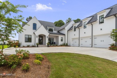 Experience resort-style living in this exceptional residence on Reunion Golf Club in Mississippi - for sale on GolfHomes.com, golf home, golf lot