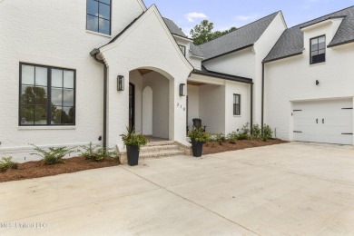 Experience resort-style living in this exceptional residence on Reunion Golf Club in Mississippi - for sale on GolfHomes.com, golf home, golf lot