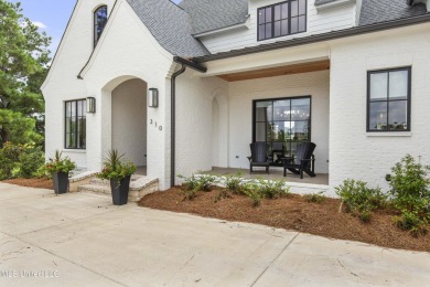 Experience resort-style living in this exceptional residence on Reunion Golf Club in Mississippi - for sale on GolfHomes.com, golf home, golf lot
