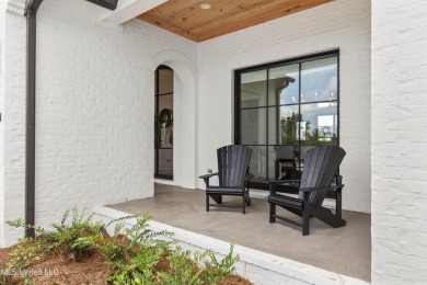 Experience resort-style living in this exceptional residence on Reunion Golf Club in Mississippi - for sale on GolfHomes.com, golf home, golf lot