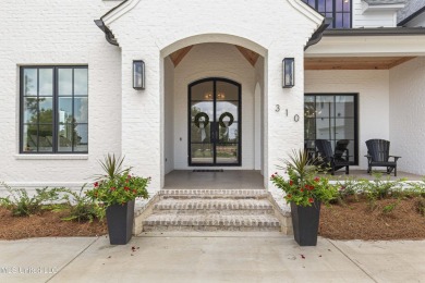 Experience resort-style living in this exceptional residence on Reunion Golf Club in Mississippi - for sale on GolfHomes.com, golf home, golf lot