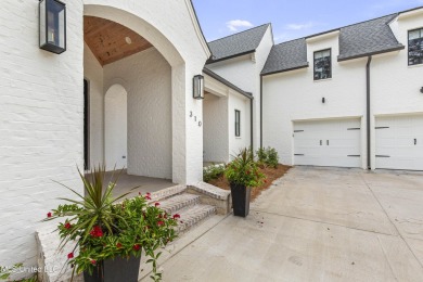 Experience resort-style living in this exceptional residence on Reunion Golf Club in Mississippi - for sale on GolfHomes.com, golf home, golf lot