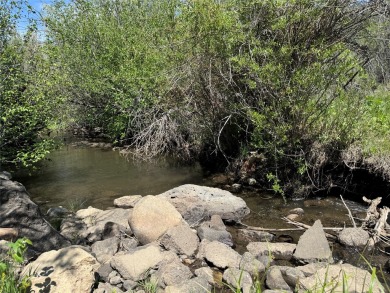 Conveniently located halfway between Taos and Angel Fire, along on El Valle Escondido Golf Course in New Mexico - for sale on GolfHomes.com, golf home, golf lot