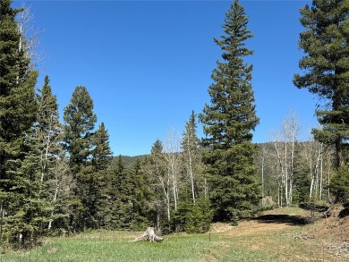 Conveniently located halfway between Taos and Angel Fire, along on El Valle Escondido Golf Course in New Mexico - for sale on GolfHomes.com, golf home, golf lot