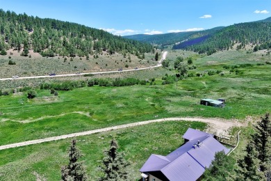 Conveniently located halfway between Taos and Angel Fire, along on El Valle Escondido Golf Course in New Mexico - for sale on GolfHomes.com, golf home, golf lot