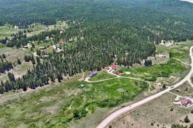 Conveniently located halfway between Taos and Angel Fire, along on El Valle Escondido Golf Course in New Mexico - for sale on GolfHomes.com, golf home, golf lot