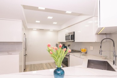 Beautifully updated open 3 bedroom 2 bath corner unit with floor on The President Country Club in Florida - for sale on GolfHomes.com, golf home, golf lot