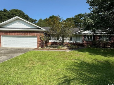 This two-bedroom three bath home is tucked away on a quiet on Wedgefield Plantation Golf Club in South Carolina - for sale on GolfHomes.com, golf home, golf lot