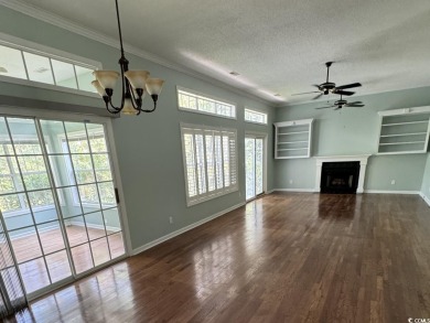 This two-bedroom three bath home is tucked away on a quiet on Wedgefield Plantation Golf Club in South Carolina - for sale on GolfHomes.com, golf home, golf lot