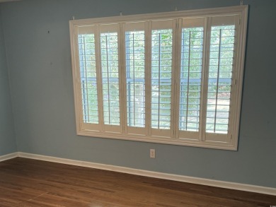 This two-bedroom three bath home is tucked away on a quiet on Wedgefield Plantation Golf Club in South Carolina - for sale on GolfHomes.com, golf home, golf lot