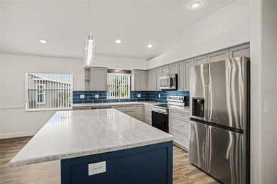 Welcome to this stunning home in the 55+ community of Tampa Bay on Tampa Bay Golf and Country Club in Florida - for sale on GolfHomes.com, golf home, golf lot