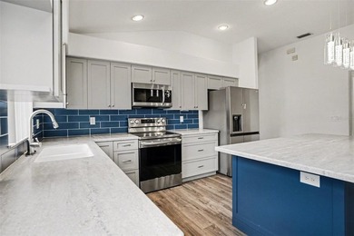 Welcome to this stunning home in the 55+ community of Tampa Bay on Tampa Bay Golf and Country Club in Florida - for sale on GolfHomes.com, golf home, golf lot