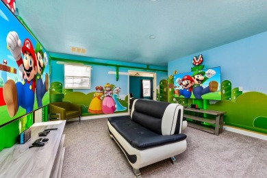 MUST SEE THIS FULLY DISNEY-THEMED POOL HOME WITH LAKE VIEW IN on The Oasis Club at Champions Gate in Florida - for sale on GolfHomes.com, golf home, golf lot