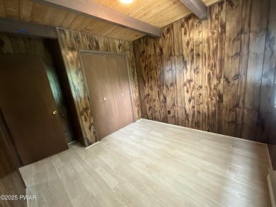 Fall in love with this sweet, simple, and affordable getaway in on The Hideout Golf in Pennsylvania - for sale on GolfHomes.com, golf home, golf lot