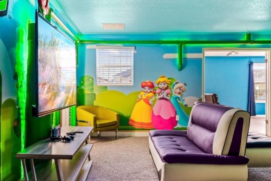 MUST SEE THIS FULLY DISNEY-THEMED POOL HOME WITH LAKE VIEW IN on The Oasis Club at Champions Gate in Florida - for sale on GolfHomes.com, golf home, golf lot