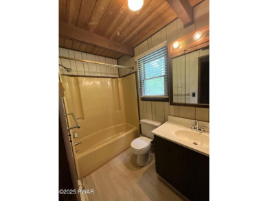 Fall in love with this sweet, simple, and affordable getaway in on The Hideout Golf in Pennsylvania - for sale on GolfHomes.com, golf home, golf lot
