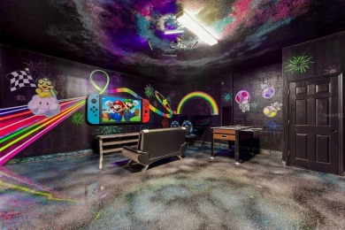 MUST SEE THIS FULLY DISNEY-THEMED POOL HOME WITH LAKE VIEW IN on The Oasis Club at Champions Gate in Florida - for sale on GolfHomes.com, golf home, golf lot