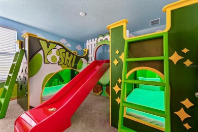 MUST SEE THIS FULLY DISNEY-THEMED POOL HOME WITH LAKE VIEW IN on The Oasis Club at Champions Gate in Florida - for sale on GolfHomes.com, golf home, golf lot