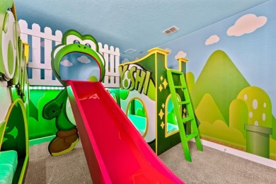 MUST SEE THIS FULLY DISNEY-THEMED POOL HOME WITH LAKE VIEW IN on The Oasis Club at Champions Gate in Florida - for sale on GolfHomes.com, golf home, golf lot