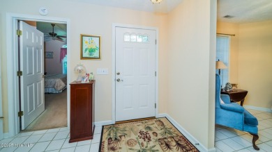 Welcome to this charming all-brick custom built home in Carolina on Carolina Shores Golf Course in North Carolina - for sale on GolfHomes.com, golf home, golf lot