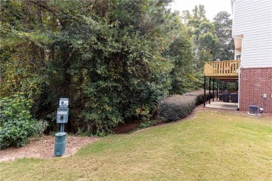 Welcome to this beautifully maintained three-level end-unit on Sugar Hill Golf Club in Georgia - for sale on GolfHomes.com, golf home, golf lot