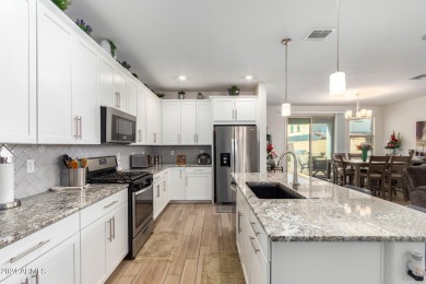 This exceptional Verrado home showcases meticulous pride of on Verrado Golf Club - Victory in Arizona - for sale on GolfHomes.com, golf home, golf lot