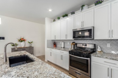 This exceptional Verrado home showcases meticulous pride of on Verrado Golf Club - Victory in Arizona - for sale on GolfHomes.com, golf home, golf lot