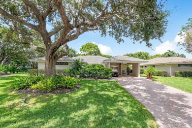 Welcome to your tranquil retreat featuring a captivating garden on Quail Ridge Golf Course and Country Club in Florida - for sale on GolfHomes.com, golf home, golf lot