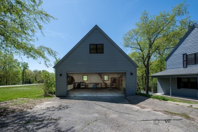 This Branigar farmhouse-style home is set on a beautiful, wooded on Eagle Ridge Inn and Resort in Illinois - for sale on GolfHomes.com, golf home, golf lot