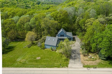 This Branigar farmhouse-style home is set on a beautiful, wooded on Eagle Ridge Inn and Resort in Illinois - for sale on GolfHomes.com, golf home, golf lot