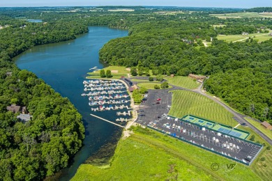 This Branigar farmhouse-style home is set on a beautiful, wooded on Eagle Ridge Inn and Resort in Illinois - for sale on GolfHomes.com, golf home, golf lot